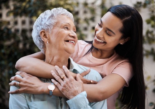 Woman hugging her grandmother.